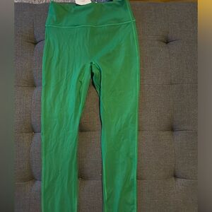 NWT Fabletics super fun green leggings/  white cross stitch design on back sz.S